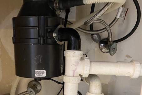 Reasons Your Garbage Disposal May Be Leaking - garbage disposal tank