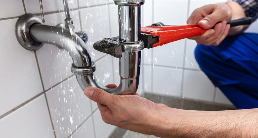 Plumber detecting water leaks and fixing it