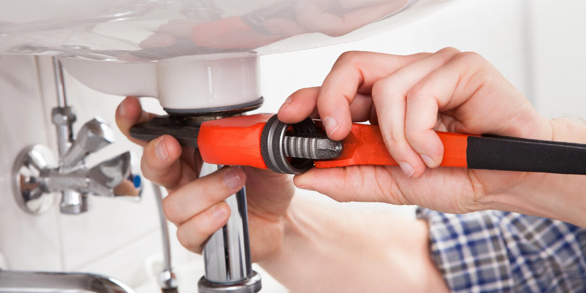 plumber repairing pipes